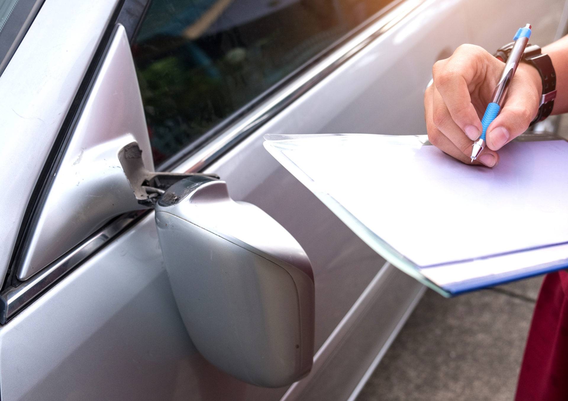 insurance officer checking car accident,car accident broken sid